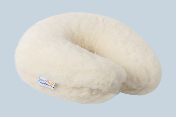 The best partner on the journey. Neck pillow with memory foam and cover of soft cashmere and merino lamb's wool